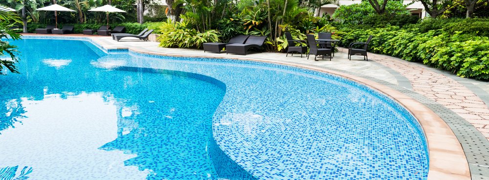 Freeform garden swimming pool with mosaic tiling